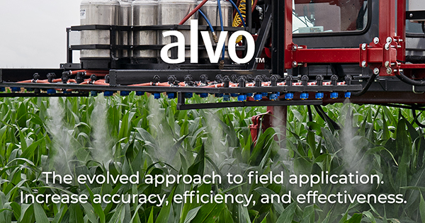 Image of the Alvo Field Applicator applying a treatment to crops with text that reads "The evolved approach to field application. Increase accuracy, efficiency, and effectivenes."